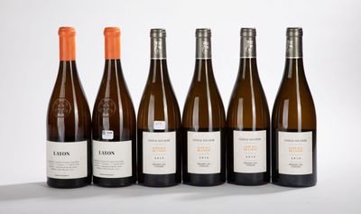 six bottles of wine are lined up in a row