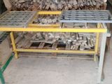 a large pile of wood sitting on a table in a warehouse