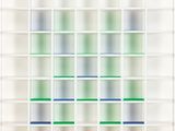 an image of a white bookcase filled with green and blue books