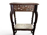 an image of a wooden table with a floral design on it
