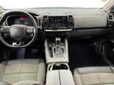 the interior of a car with a steering wheel, dashboard, and dashboard controls