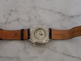 an image of a close up of a wrist watch on a marble surface