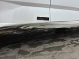 a white car with a sticker on the side of it