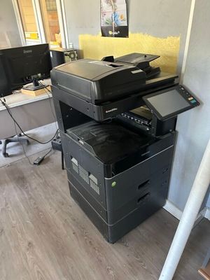 a photo of a printer sitting on top of a desk