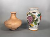 two vases sitting next to each other on a table