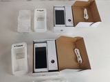 a box with a phone inside of it on a table