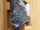 a box with a umbrella inside of it that is wrapped in plastic