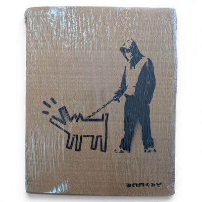 a picture of a man with a chainsaw on a cardboard box