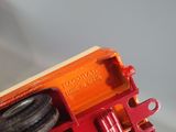 a close up of a toy train on a white surface
