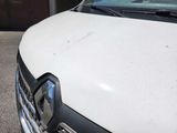 a white truck parked in front of a building