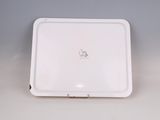 a white tray with a white lid on a table