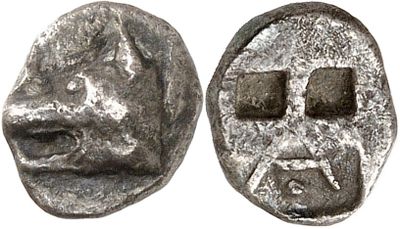 a close up of a coin with a face on it