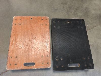 two pieces of wood sitting next to each other on the floor