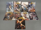 the comic books are lined up on a table