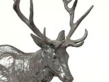 a statue of a deer with antlers on it ' s head