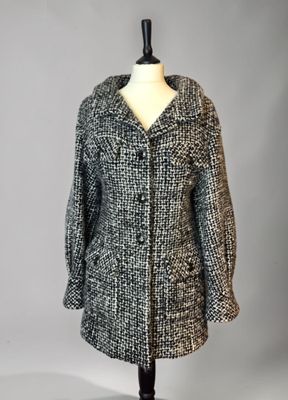 a black and white coat on a mannequin mannequin mannequin mannequin mannequin mannequin mannequin mannequin mann