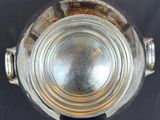 overhead view of a glass of water on a black surface
