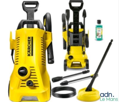 a yellow pressurer sitting next to other cleaning supplies on a white surface