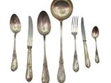 five spoons, two forks, and a spoon on a white background