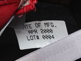 a label on a red purse that says state of mg apr 2009 lott 2006