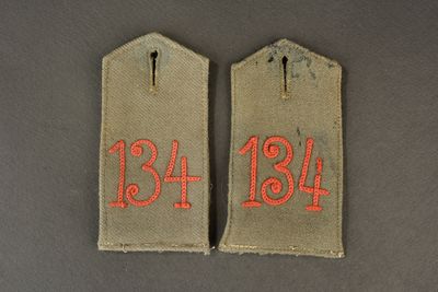 two tags with the numbers thirteen and thirteen on them