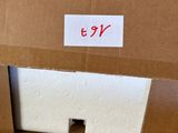 a cardboard box with a sticker on it sitting on a table
