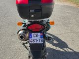 a motorcycle that is parked on the side of the road