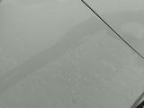 a close up of a car ' s door handle and the door handle of the car