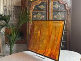 a picture of a painting on a table in a living room