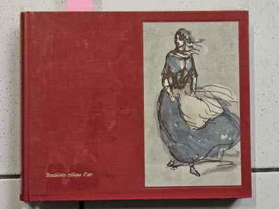 a red book with a picture of a woman in a blue dress