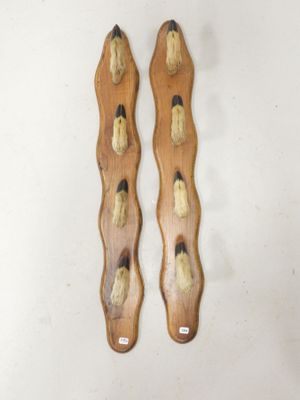 pair of wooden spoons with black and white designs on them