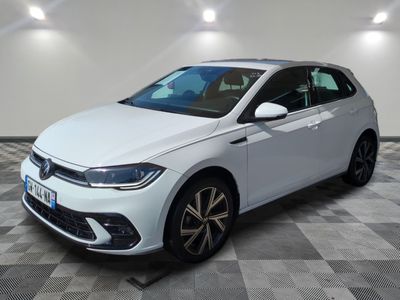the white volkswagen polo estate is parked in a room with a checkered floor