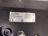 a close up of a metal object with a label on it