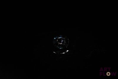 an image of a ring in the dark of night