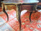 a small table with a glass top on a rug