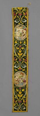 a close up of a green and yellow wall hanging with birds