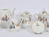 many different types of teapots and saucers on the table