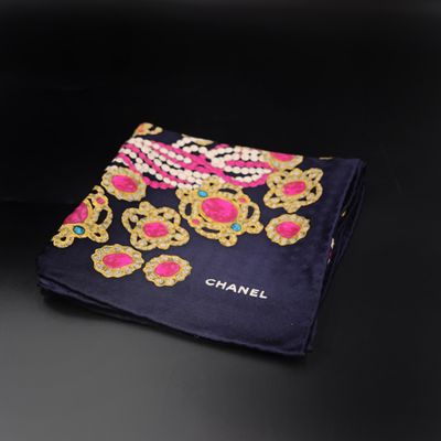 a close up of a black and pink scarf with gold and pink flowers