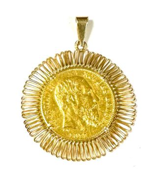 an image of a gold coin pendant with a woman ' s face on it