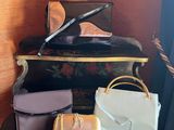 several pieces of luggage sitting on top of a table next to a window