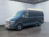 an image of a black van parked in a garage