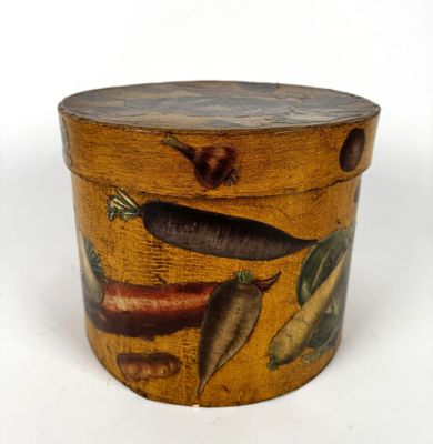 a wooden box with a painting of vegetables on it