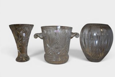 three vases sitting next to each other on a white surface