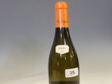 a bottle of wine that is sitting on a table