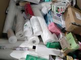 a cardboard box full of toilet paper and other items
