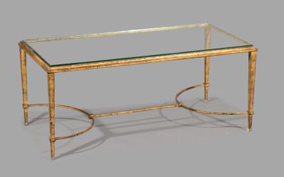 a glass top coffee table with a gold metal frame