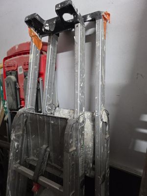 two ladders that are sitting next to each other