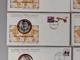 six stamps with a map of the world on them are on a table