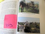 an open book with a picture of a horse drawn carriage on it