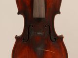 an old violin with a wooden bow hanging from it ' s back